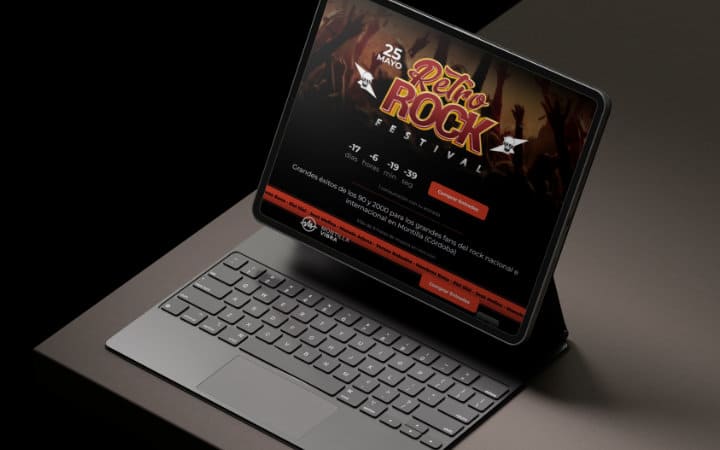 Laptop displaying the website of the 'Retro Rock Festival'.