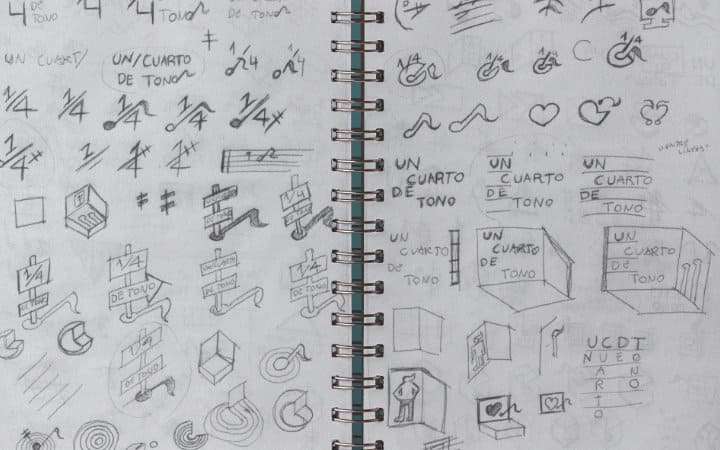 Detail of the process of creating the graphic brand of Cuarto de Tono in a sketchbook.